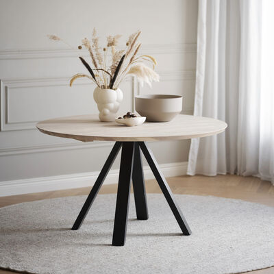 Rowico Home Carradale pyöreä ruokapöytä Ø 130 cm valkopesty/musta V-jaloilla